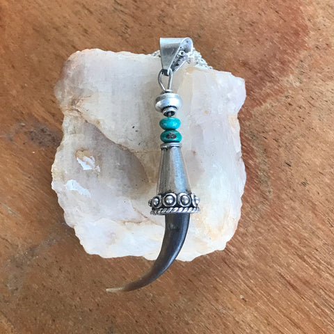 Eagle Claw Pendent Set in Sterling Silver and Turquoise Accent.